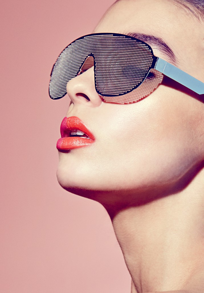 Model wearing sunglasses in a multiple lipstick colors in summer photoshoot by photographer, barnaby newton and makeup by makeup artist, veronica peters in london